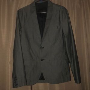 Young man Suit that is grey with stripes